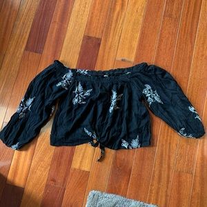 Black off shoulder top with white floral pattern